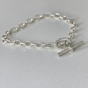 Pulsera rolo de plata con cierre micropave circulo