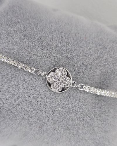 Pulsera de plata con dije flor