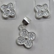 Conjunto de flor aros más dije Plata 925