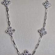 Gargantilla forcet con dije de flores pave y brillo Plata rodinada