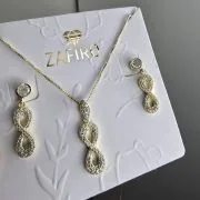 Conjunto infinito con cubic plata con baño gold. Aro+dije+cadena
