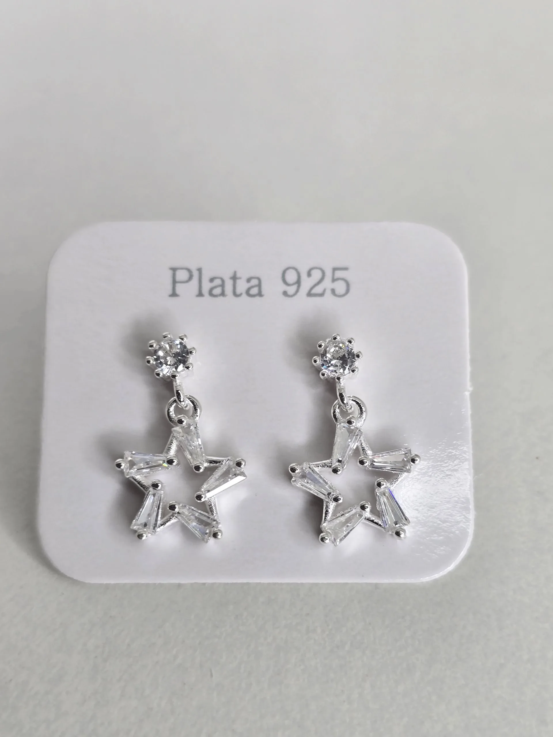Aros pasantes estrella de plata con  punto luz