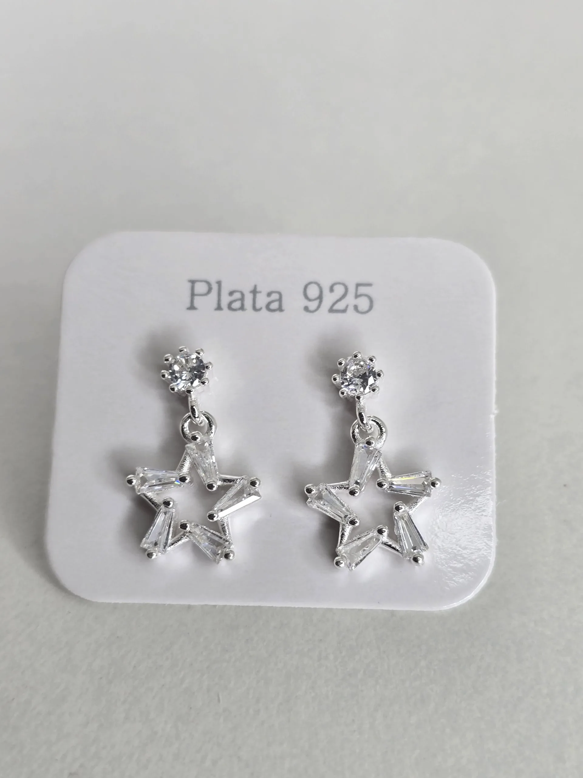 Aros pasantes estrella de plata con  punto luz