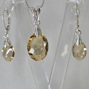 Aros brisura ovalados ambar plata -cristal swarovski