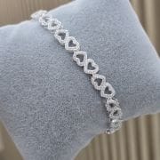 Pulsera de corazones calados con pave de Plata