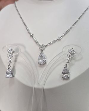 Conjunto gota plata rodinada cadena más aros