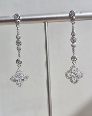 Aros alargados cubic mas flor plata rodinada
