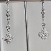 Aros alargados cubic mas flor plata rodinada