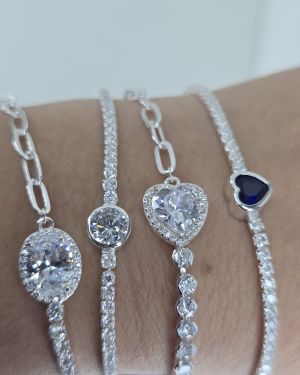 Pulsera tenis plata con punto de luz circular