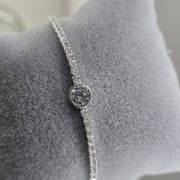 Pulsera tenis plata con punto de luz circular