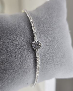 Pulsera tenis plata con punto de luz circular